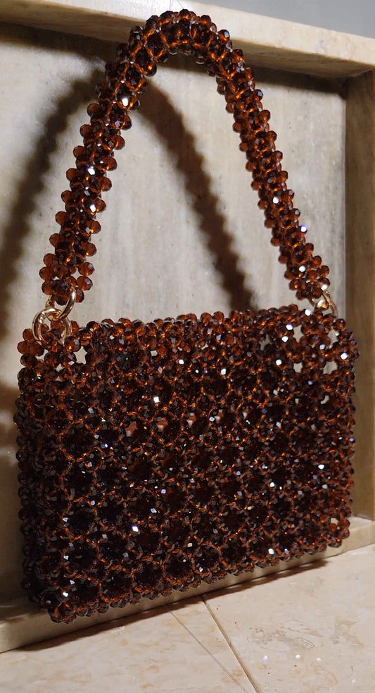 Pic 1 of 5 Lifestyle photo of Beaded Clutch Bag in Mahagony Brown 
