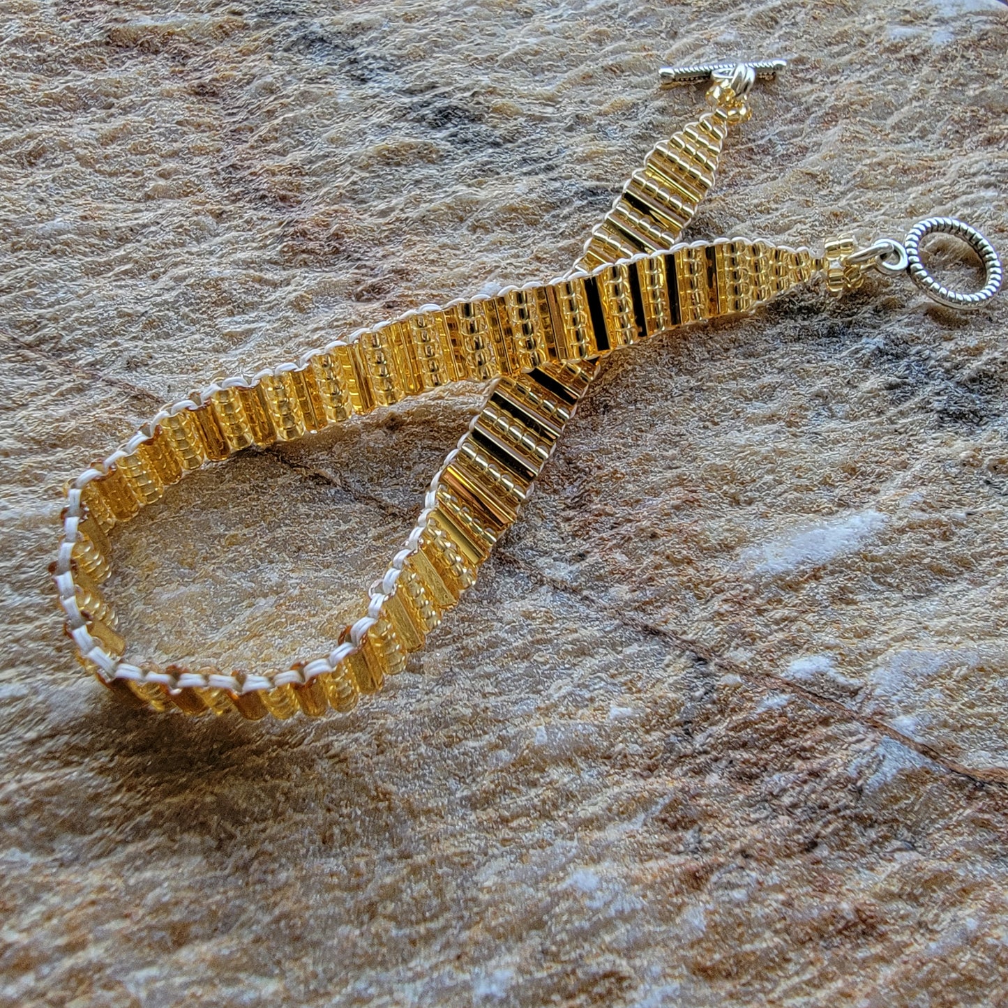 Picture of 4 of 5 of Goddess Bracelet in Gleaming Gold lifestyle shot second angle