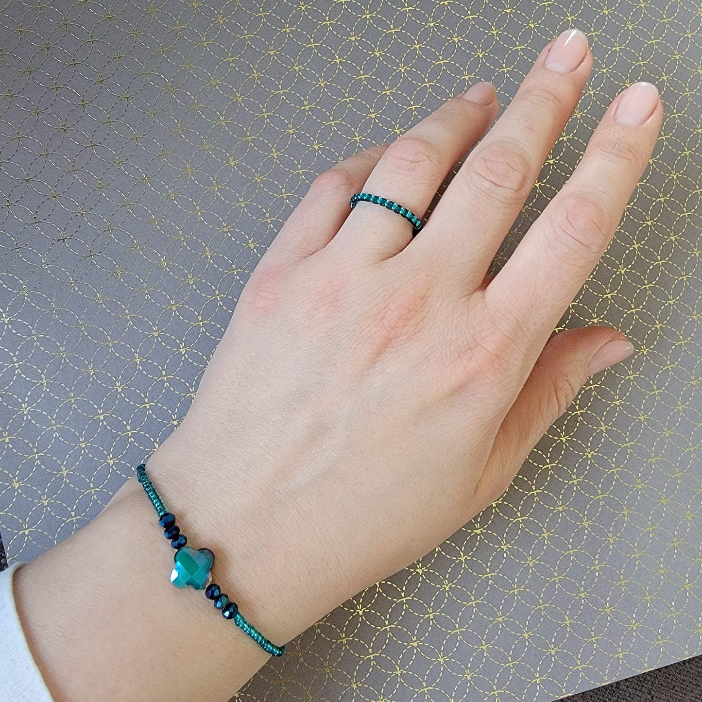 Picture 4 of 4 showing Pacific Cyan Bracelet product shot with hand model wearing it