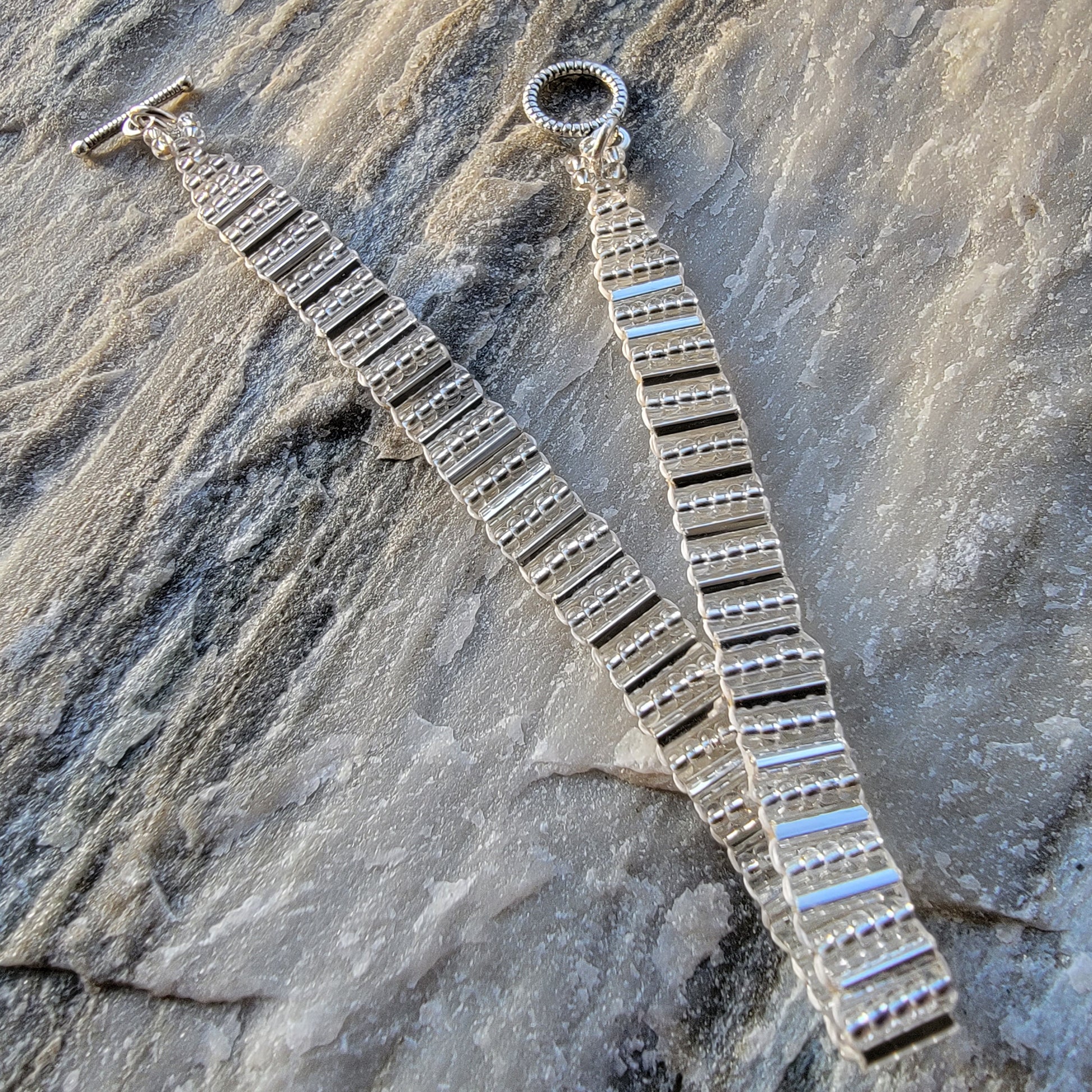 Picture of 2 of 5 of Goddess Bracelet in Gleaming Silver product shot with stone background